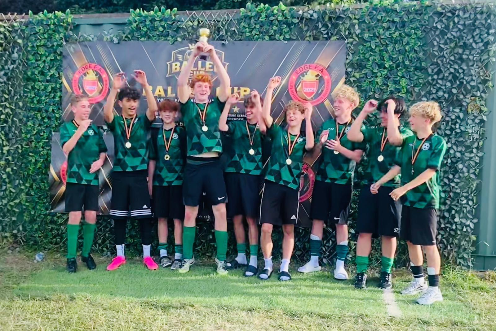 Linslade Galaxy players celebrating with medals and a trophy