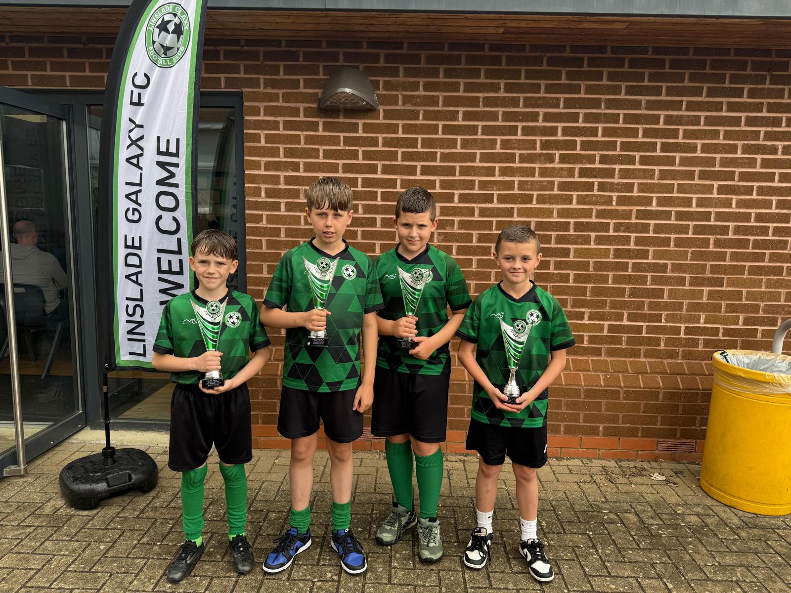 Young Linslade Galaxy players holding their awards